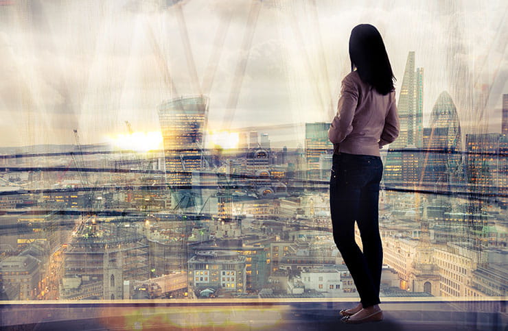 Woman looking over the city at sunset: 2020 recruiting trends