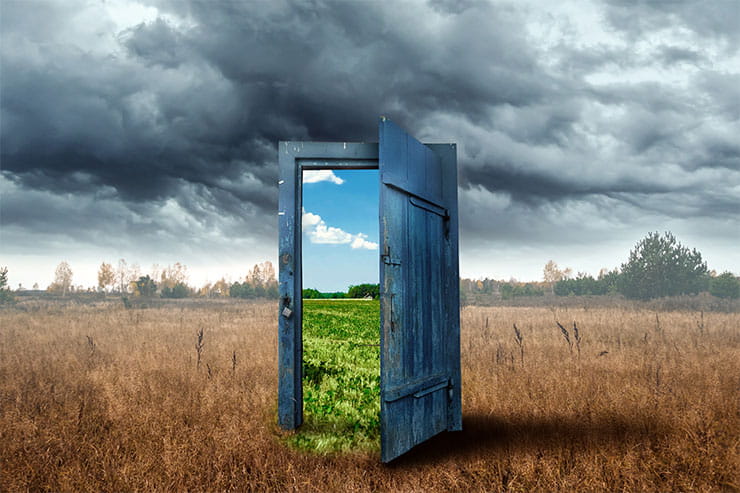 How to change careers: Old wooden door, blue colour, in the box. Transition to a different climate.