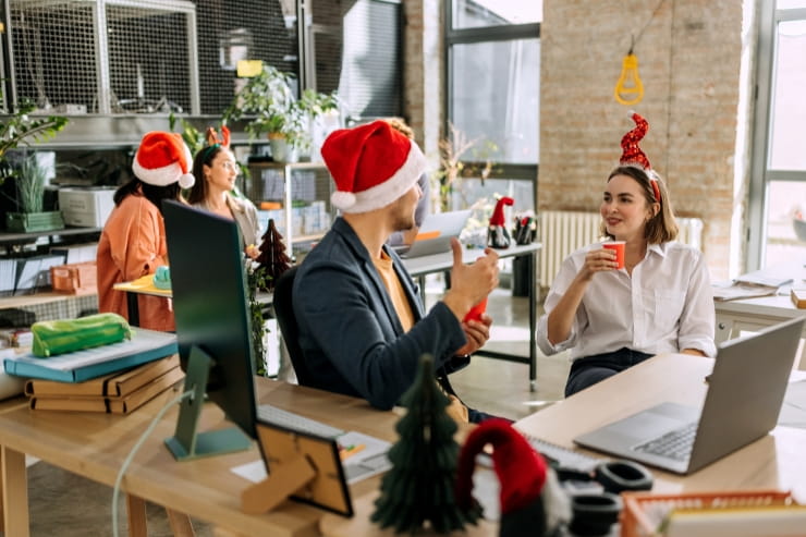 coworkers celebrating christmas in office