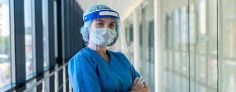 medical professional wearing mask in hallway