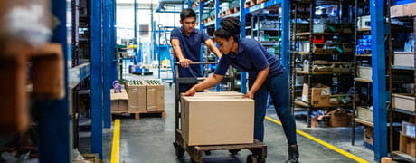warehouse workers with box